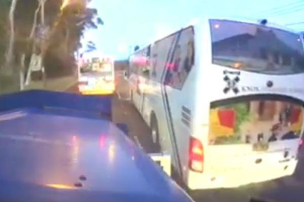Article image for Knox Grammar school bus almost taking out a truckie in northern Sydney