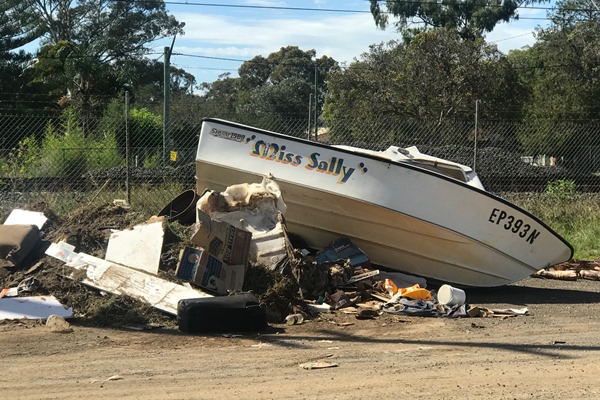 Article image for Boat dumped on the side of the road