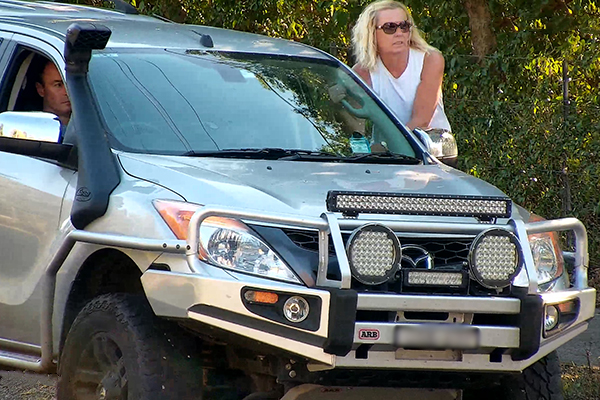 Article image for WATCH | Woman hanging off the side of moving 4WD