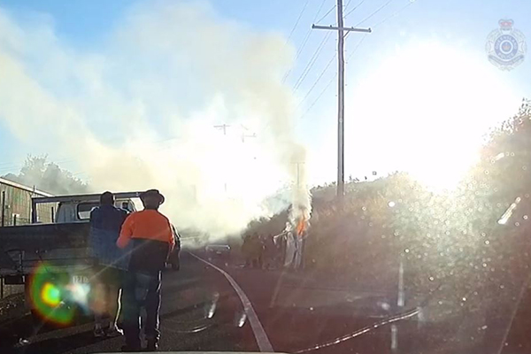Article image for WATCH | Heroic QLD cops pull man from burning car
