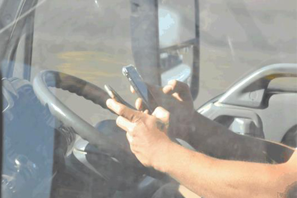 Article image for GALLERY | Drivers snapped using their phones behind the wheel