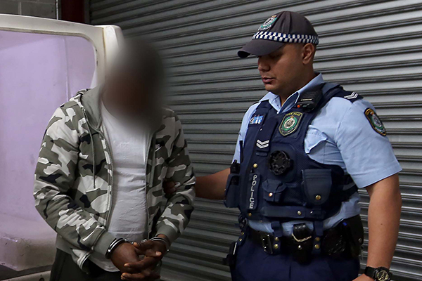Article image for Police bust $3-million scam ring run out of Villawood Detention Centre