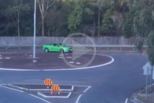 Article image for WATCH | P-plater drifting around a suburban roundabout