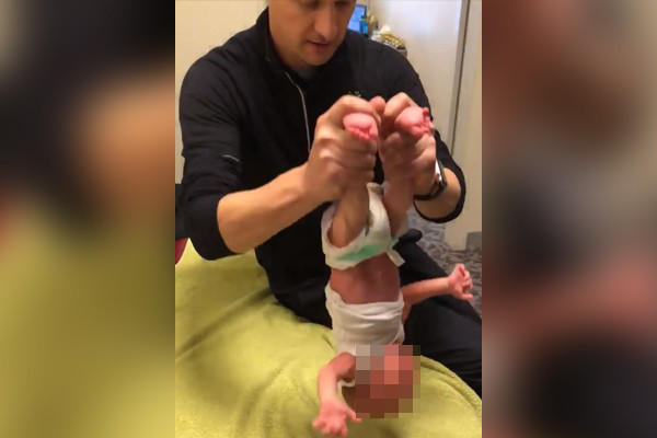 Article image for Shocking footage shows ‘rogue’ chiropractor treating a two-week-old baby