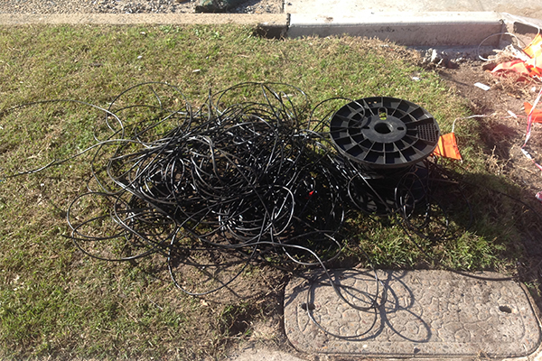 Article image for Telstra workers leave pile of rubbish outside customer’s house