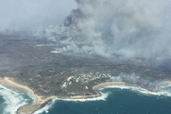 Article image for Bushfire threat far from over despite easing conditions