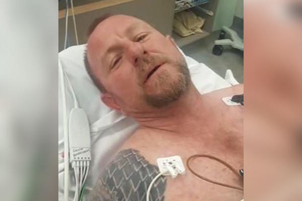 Article image for Queensland snake catcher hospitalised after bite from eastern brown snake