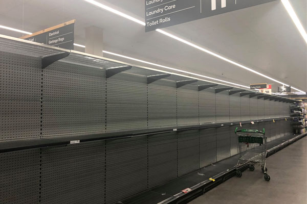 Article image for Supermarkets consider product limits as panic buying empties shelves