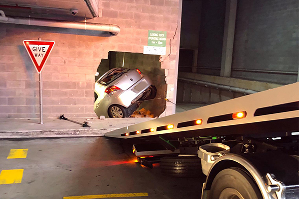 Article image for Car smashes through wall at Sydney Woolworths
