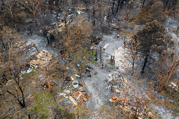 Article image for Bushfire-ravaged locals living in tents unable to access millions in donations