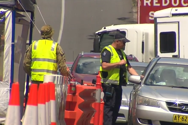 Article image for Police swarm the Queensland-NSW border in preparation for partial relaxation