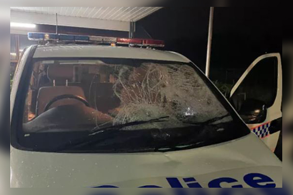 Police showered with glass as stray wheel shatters windscreen