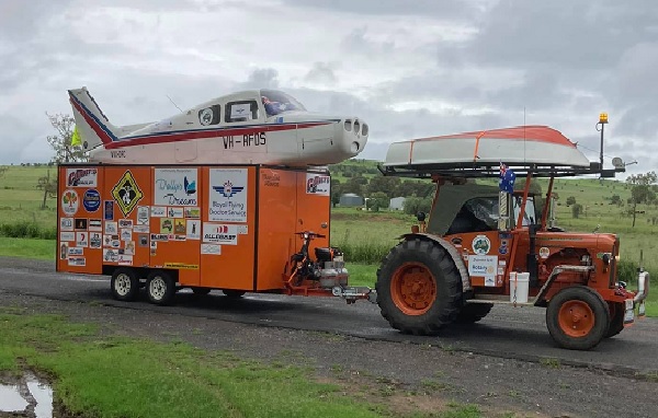 Article image for Why a man is driving a tractor and towing a plane around Australia