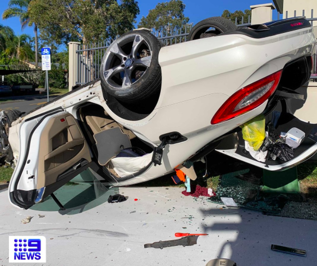 Article image for Car flips after hitting fence in Robina