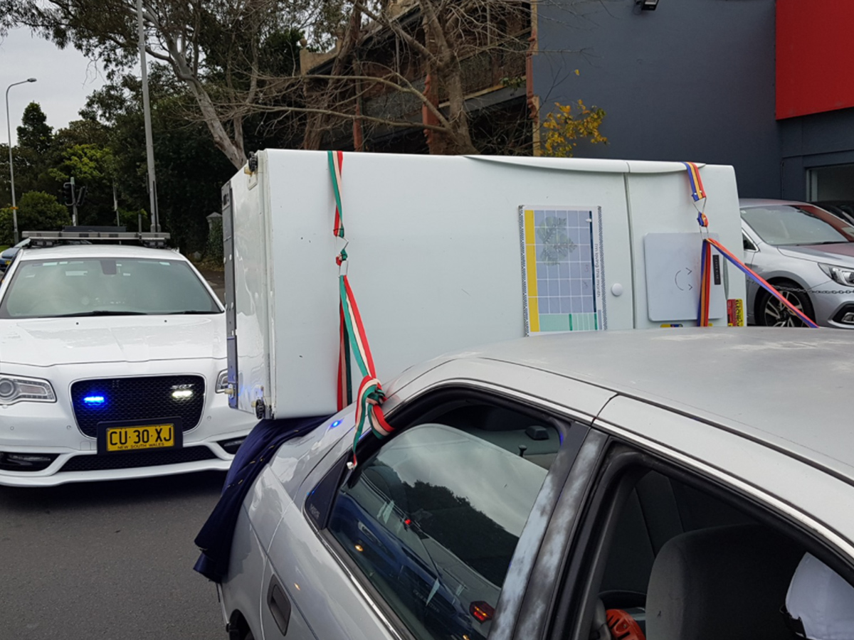 Article image for Police catch ‘some lunatic’ driving with fridge strapped to car’s boot