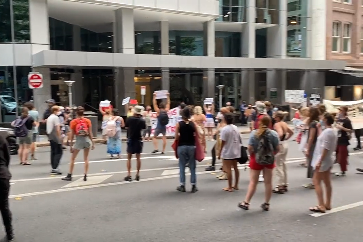 Article image for Protestors swarm Department of Home Affairs, block Adelaide Street