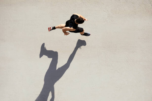 Sprinter seen from above with shadow and copy space.