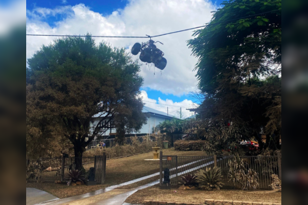 Article image for Incredible: Quad bike caught in powerlines shows flood fury