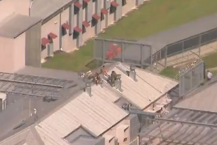 Article image for High-security prison remains in lockdown after inmates climbed onto roof 