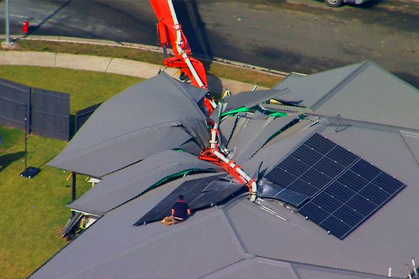 Article image for Ipswich home crushed by fallen crane with concrete pump attached