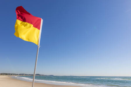 Beachgoers reminded to swim between flags following increase in rescues