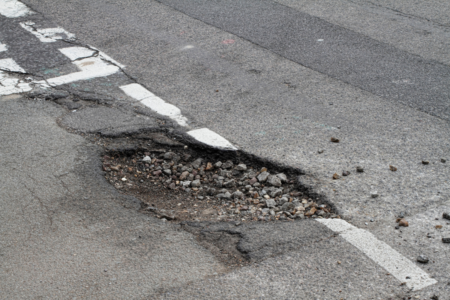 Lord Mayor Adrian Schrinner addresses Brisbane’s pot-hole problem