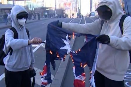 ‘No place in our society’: Melbourne protesters burn Australian flag